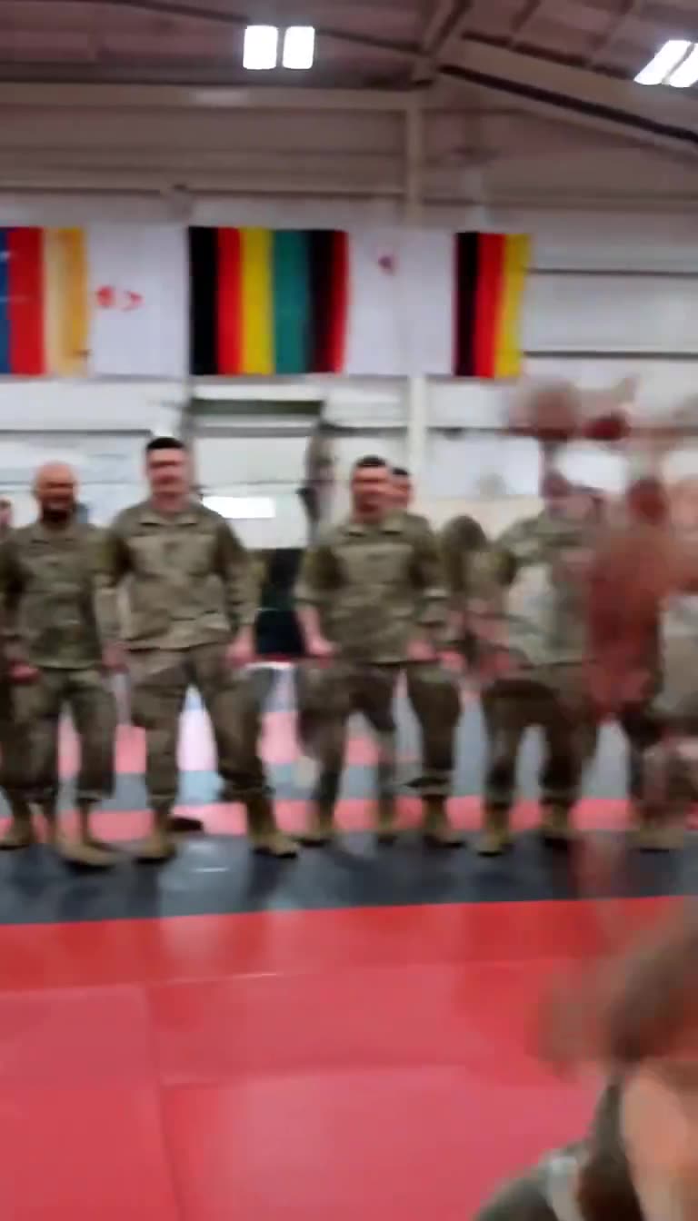 A blur of movement as the martial arts instructor throws a powerful kick
