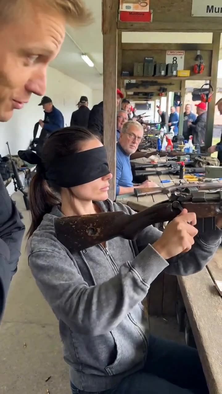 Camille fluidly raises the vintage rifle and racks the bolt while completely blindfolded.