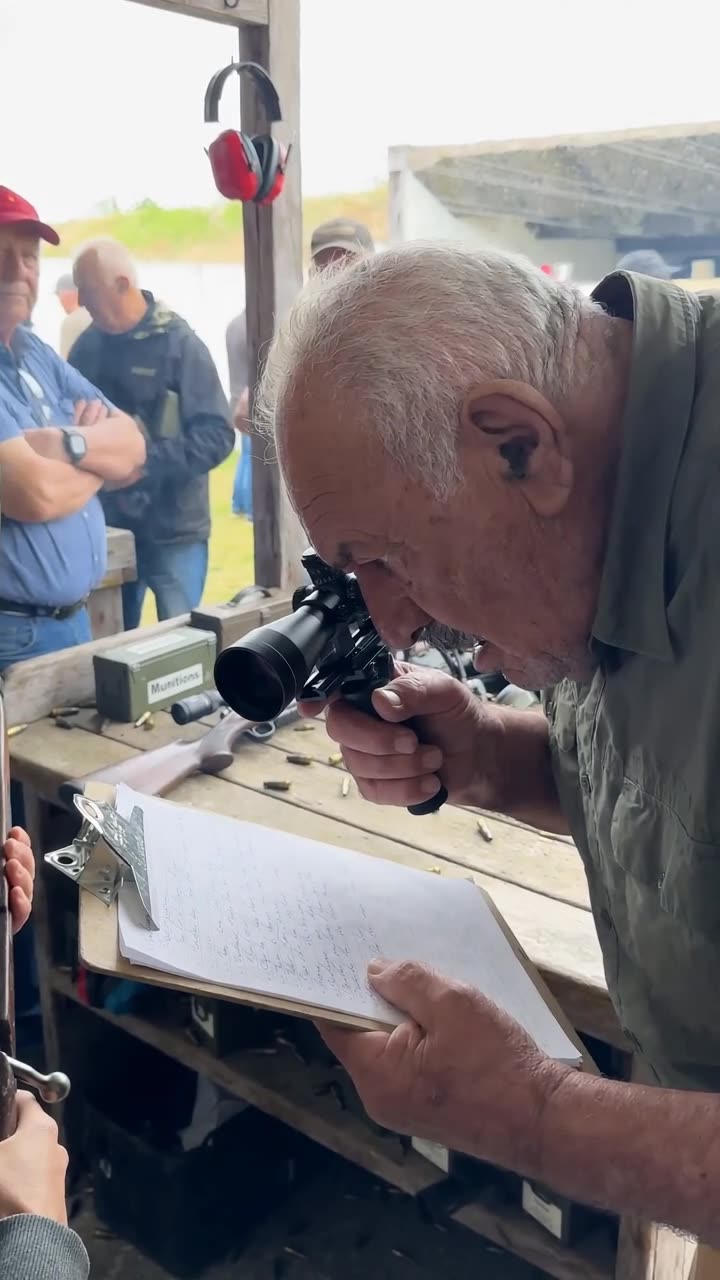 Close-up of Gérard looking through the handheld scope with his mouth open in disbelief.