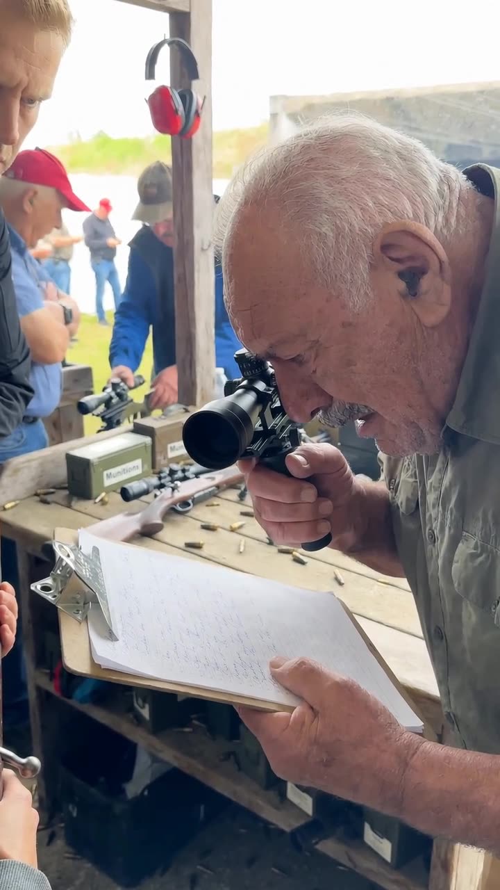 Gérard inspecting the sign-in sheet on his clipboard with visible shock.