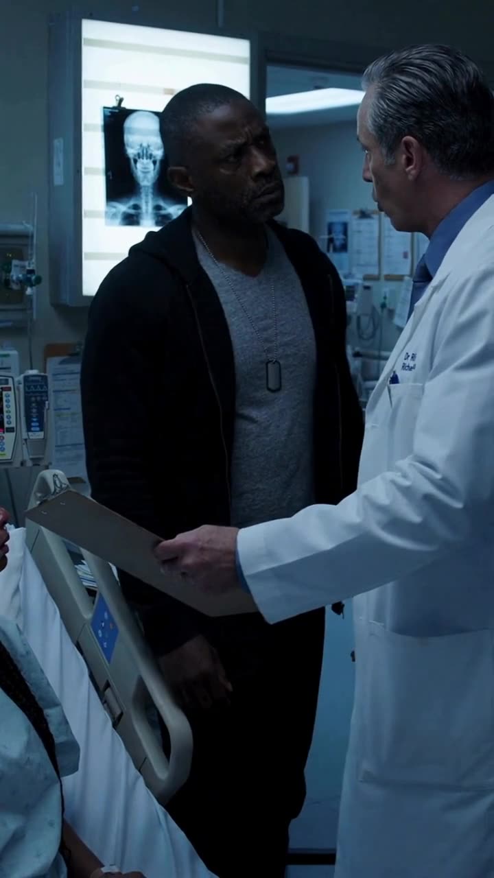 Marcus stands up to confront the physician holding out a waiver clipboard