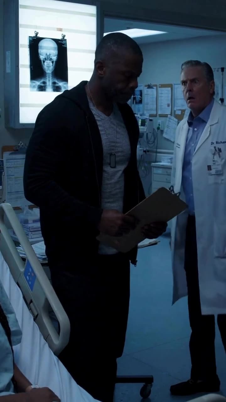 Marcus holding the clipboard as the stunned doctor recoils in disbelief
