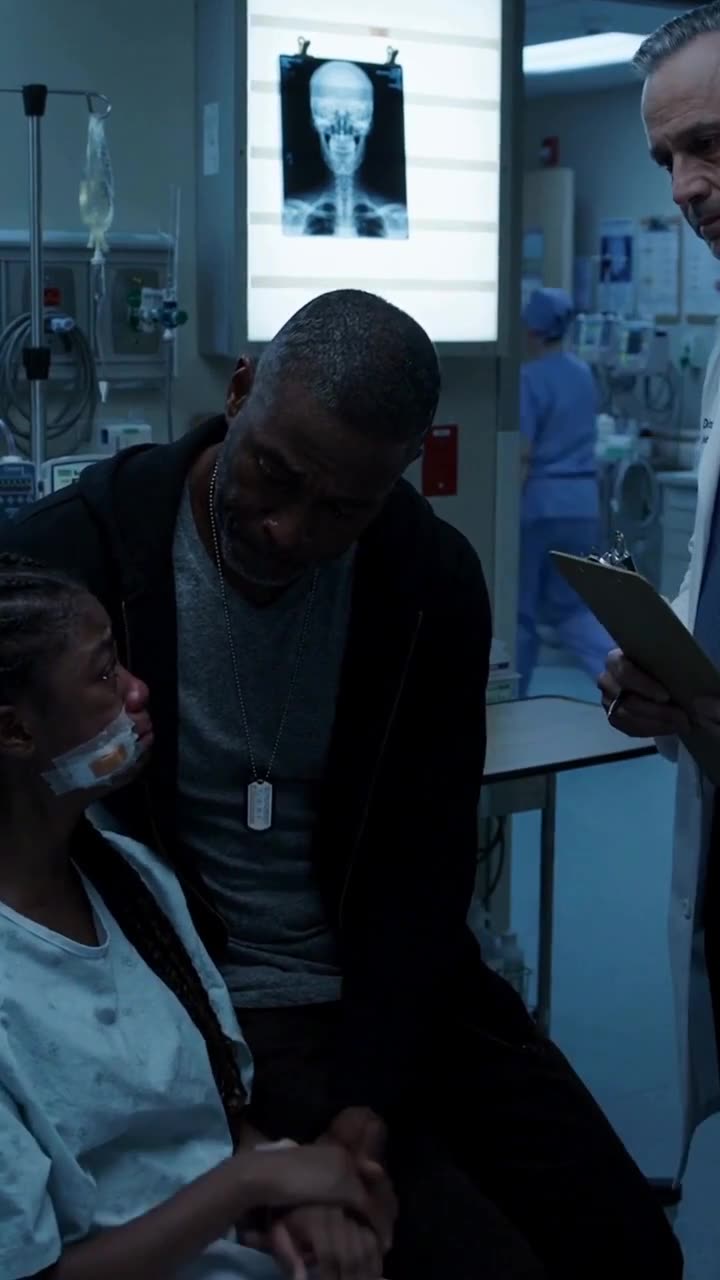 Daniel Mercer comforting his injured daughter Lily in her trauma hospital bed