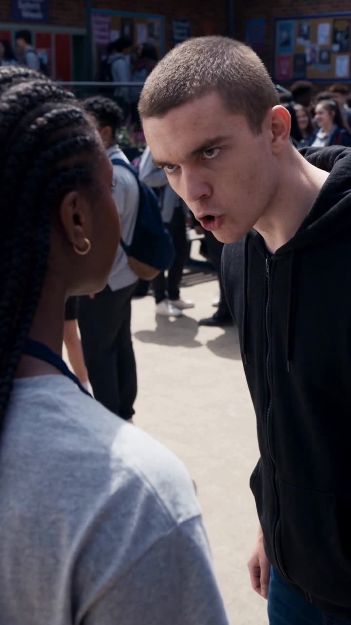 Chad leans in to shout a threat while Maya remains completely calm.