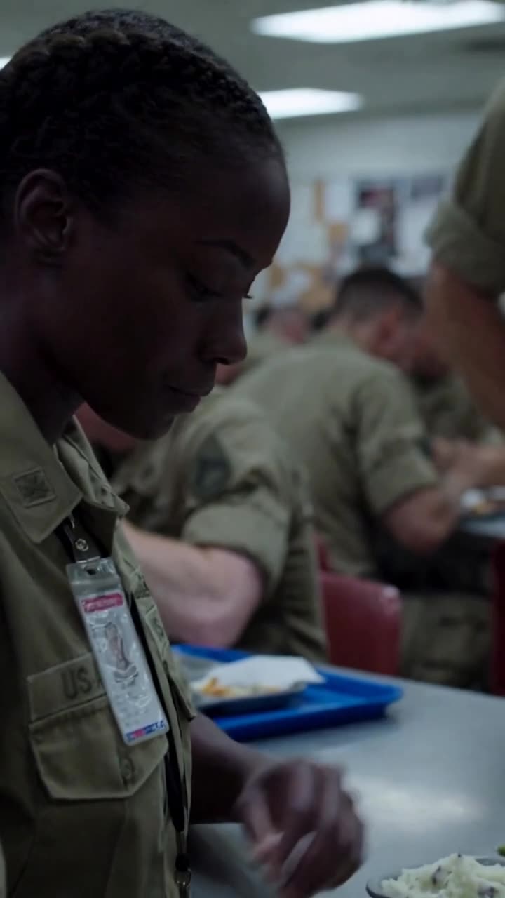 Maya reveals the laminated red-header ID card hanging from her uniform collar.