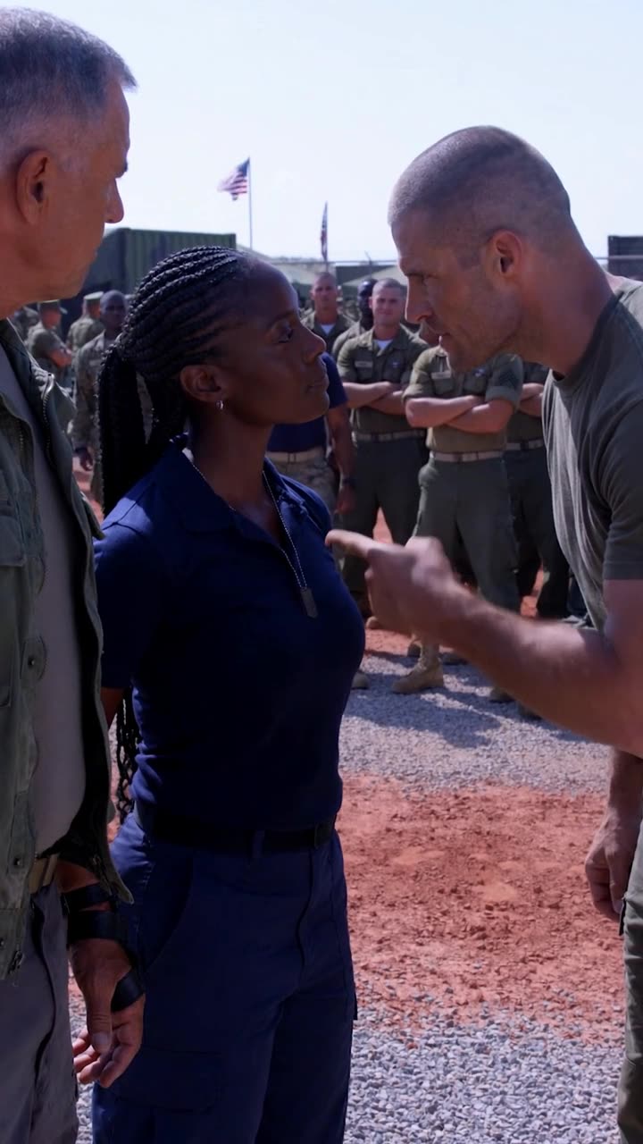 Brett aggressively points his finger in Maya's face after her sharp remark.