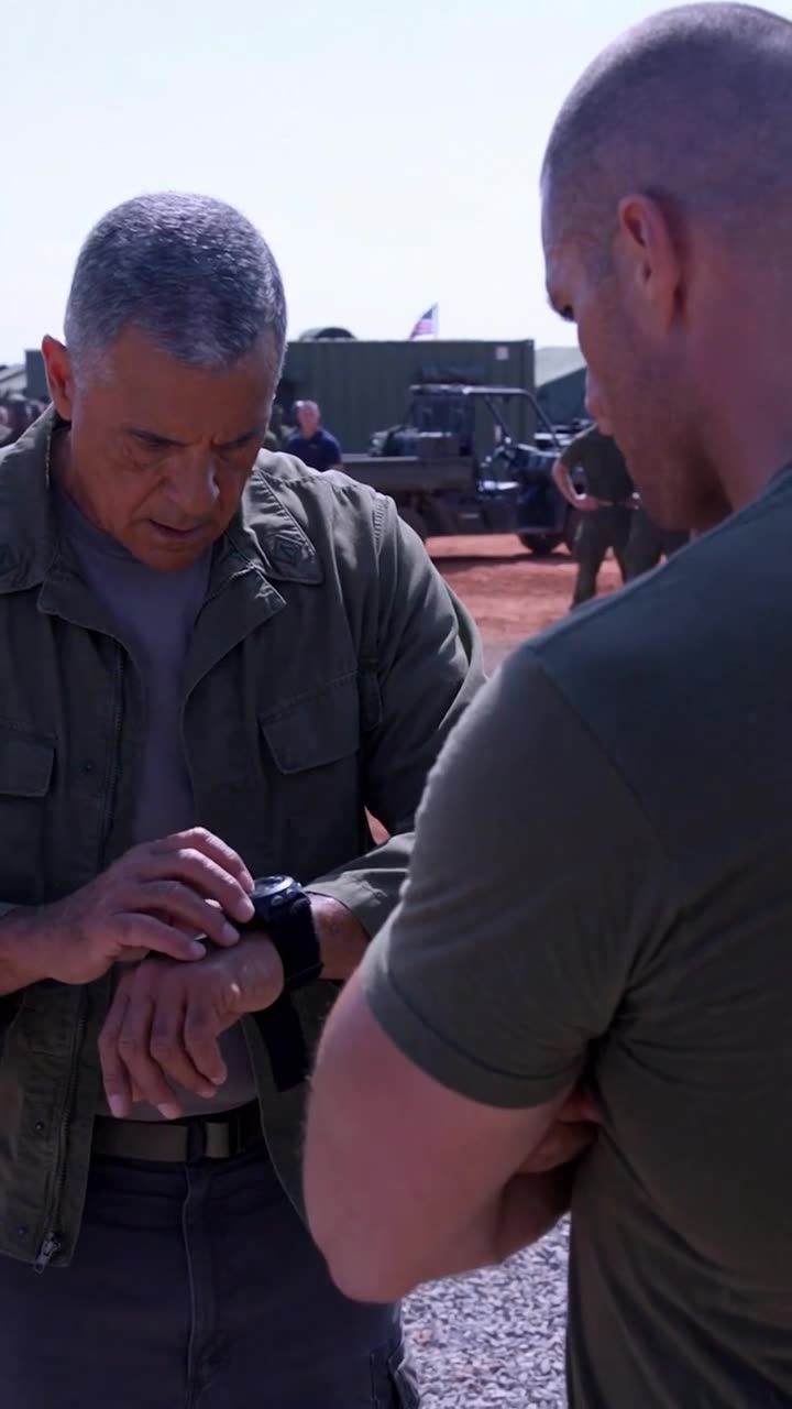 Chief Donald glances down at his wrist-mounted stopwatch during the confrontation.