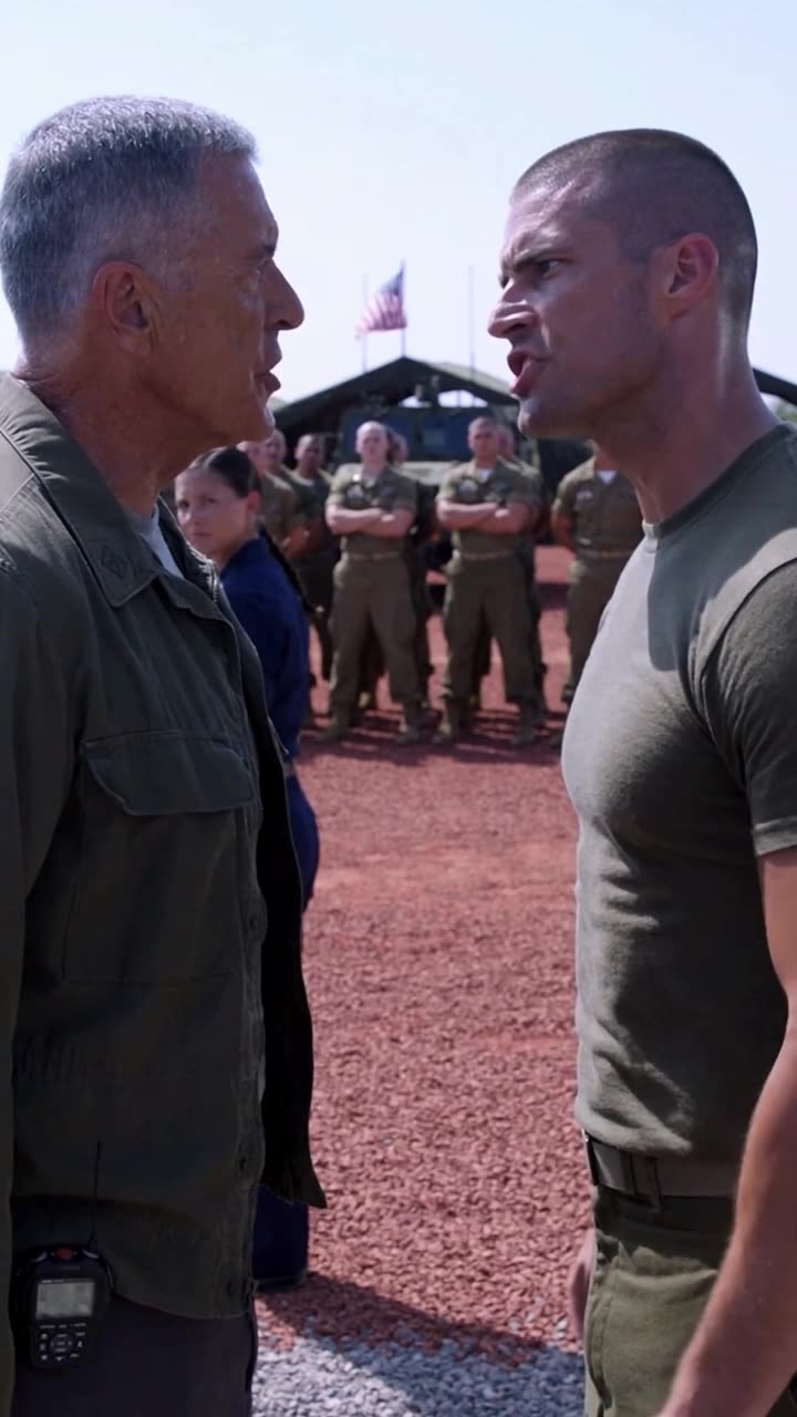 Sergeant Brett shouting in disbelief face-to-face with Chief Donald on the base grounds