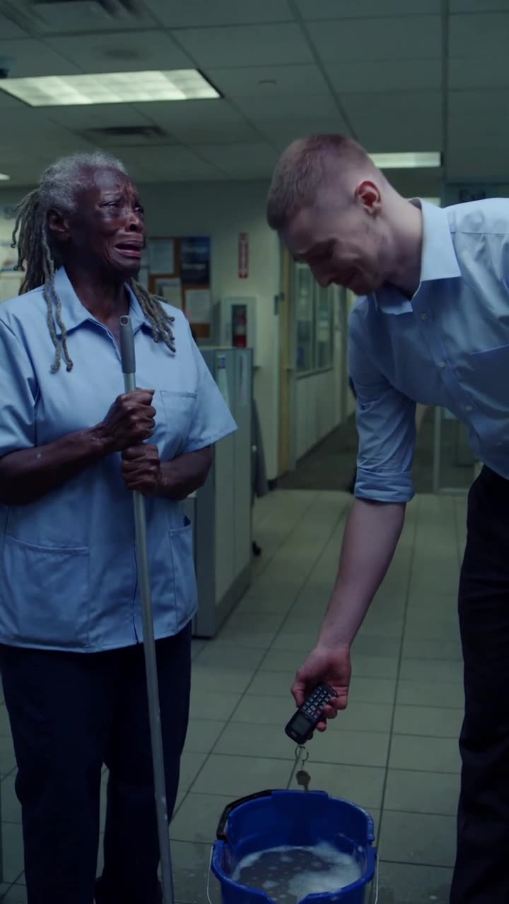 Tyler suspends the small phone directly over the soapy wash bucket as Martha weeps
