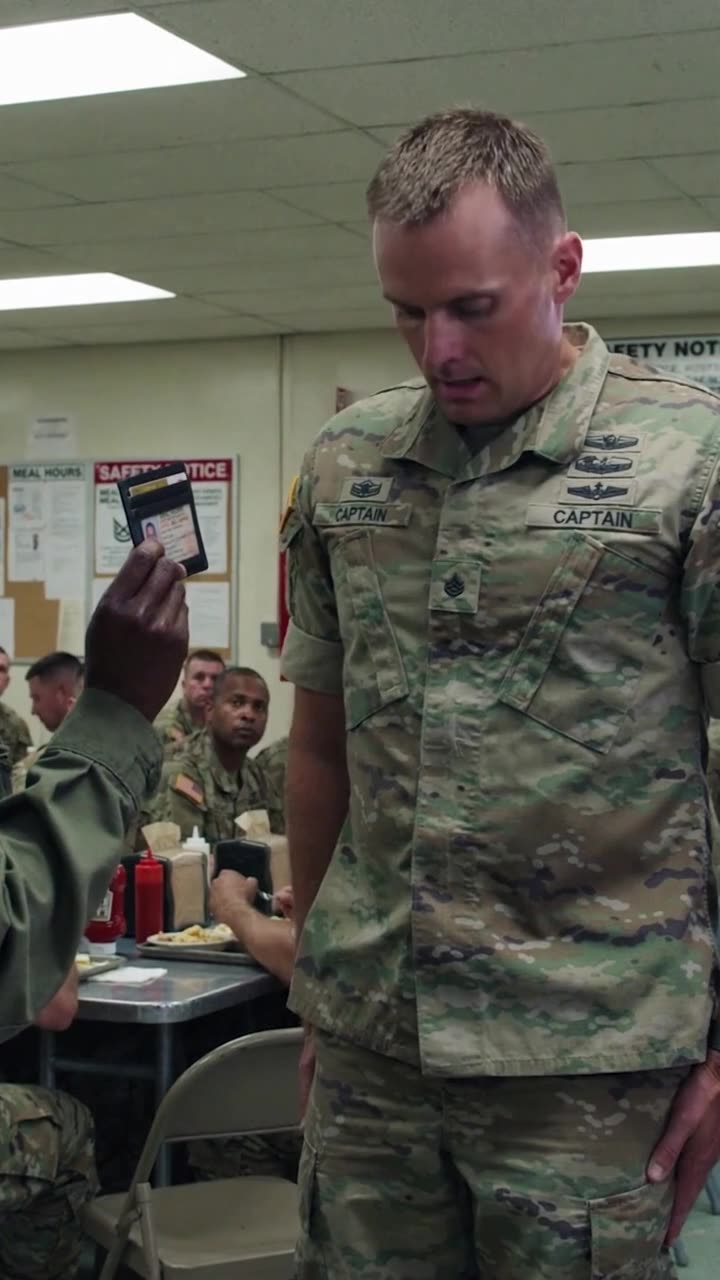 Brad stands at rigid military attention, offering a stammered apology to his superior officer.