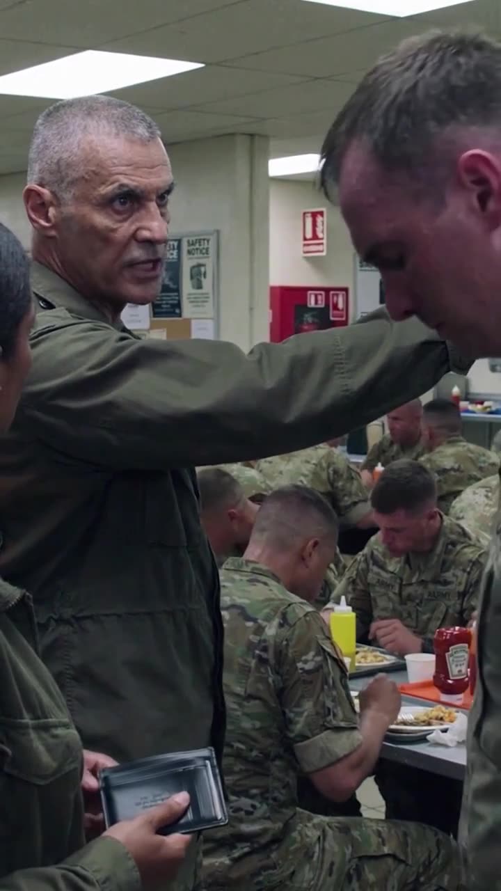 The senior commander gestures sternly while the disciplined captain bows his head in shame.