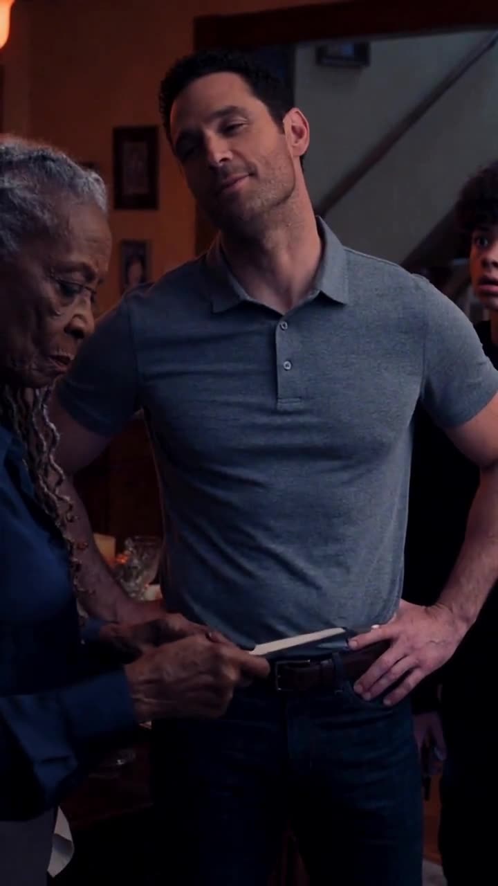 Mark tilts his head with an arrogant sneer while Tyler watches apprehensively in the background.