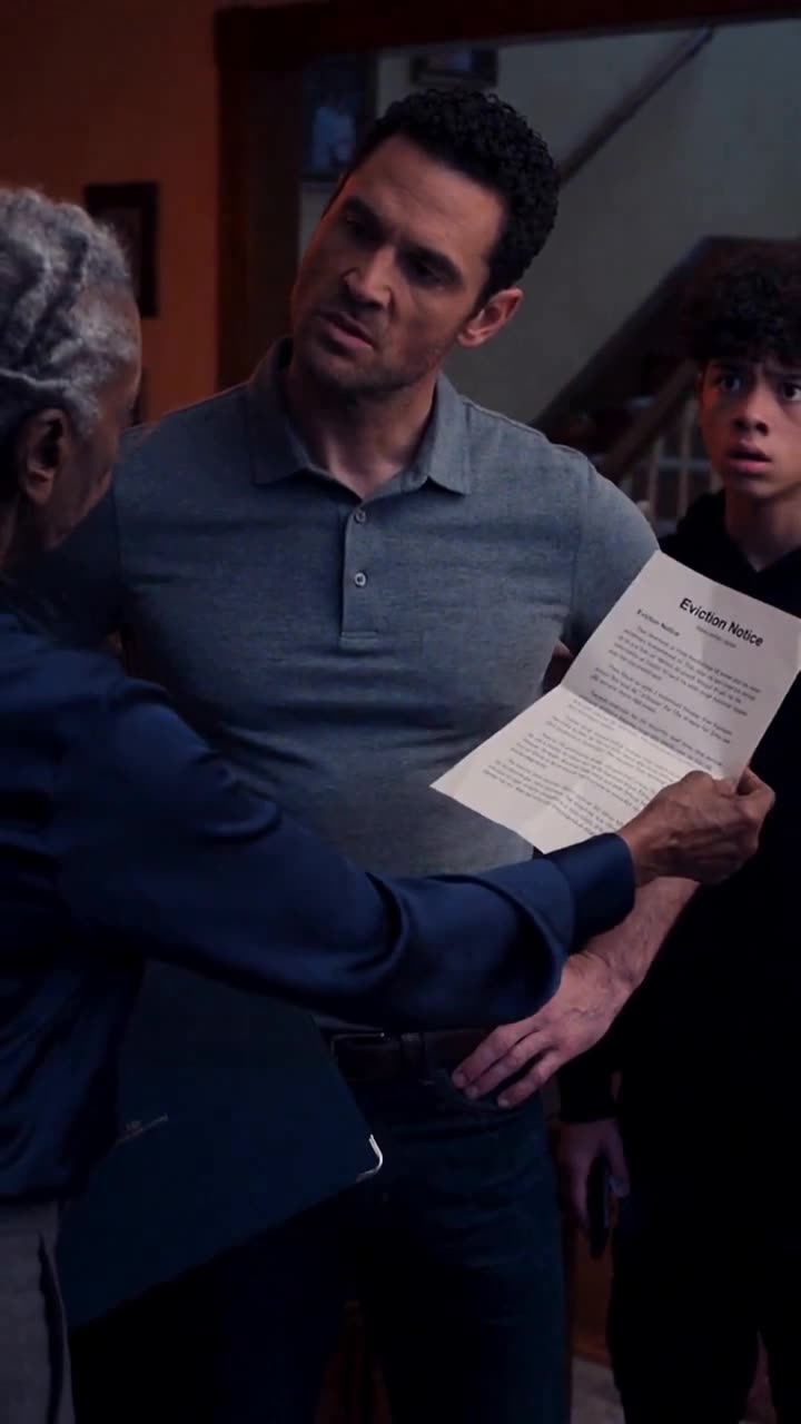 Evelyn extends an official eviction notice toward Mark, whose expression hardens into stunned disbelief.