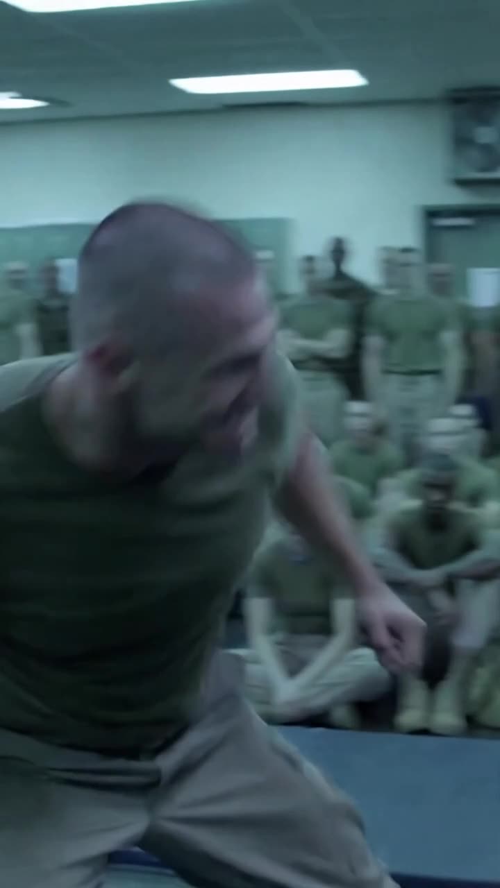 Tyler charges recklessly forward in a blur of aggressive motion during the gym combat drill.