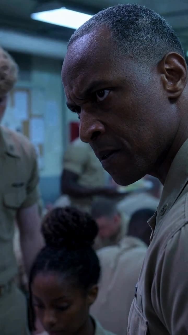 Sergeant Marcus scowls over his shoulder with deep fury and irritation