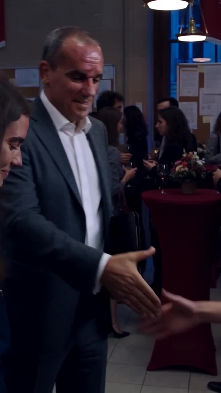 The powerful executive extends a respectful handshake to the young woman.