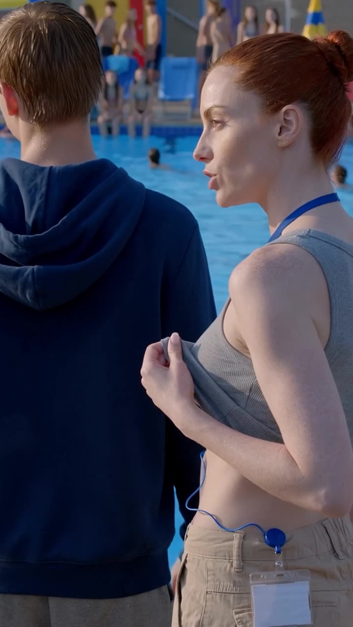 Camille subtly lifts her shirt hem to reveal an official municipal security badge.