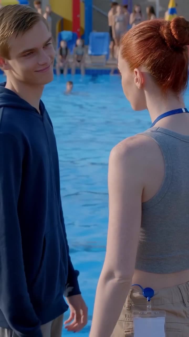 A confident red-haired staff member stands toe-to-toe with the smirking teenage aggressor
