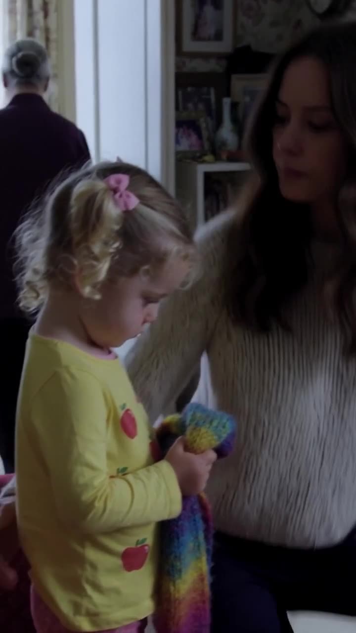 The defeated grandmother walks away into the hallway as Clara stands protectively behind her daughter.