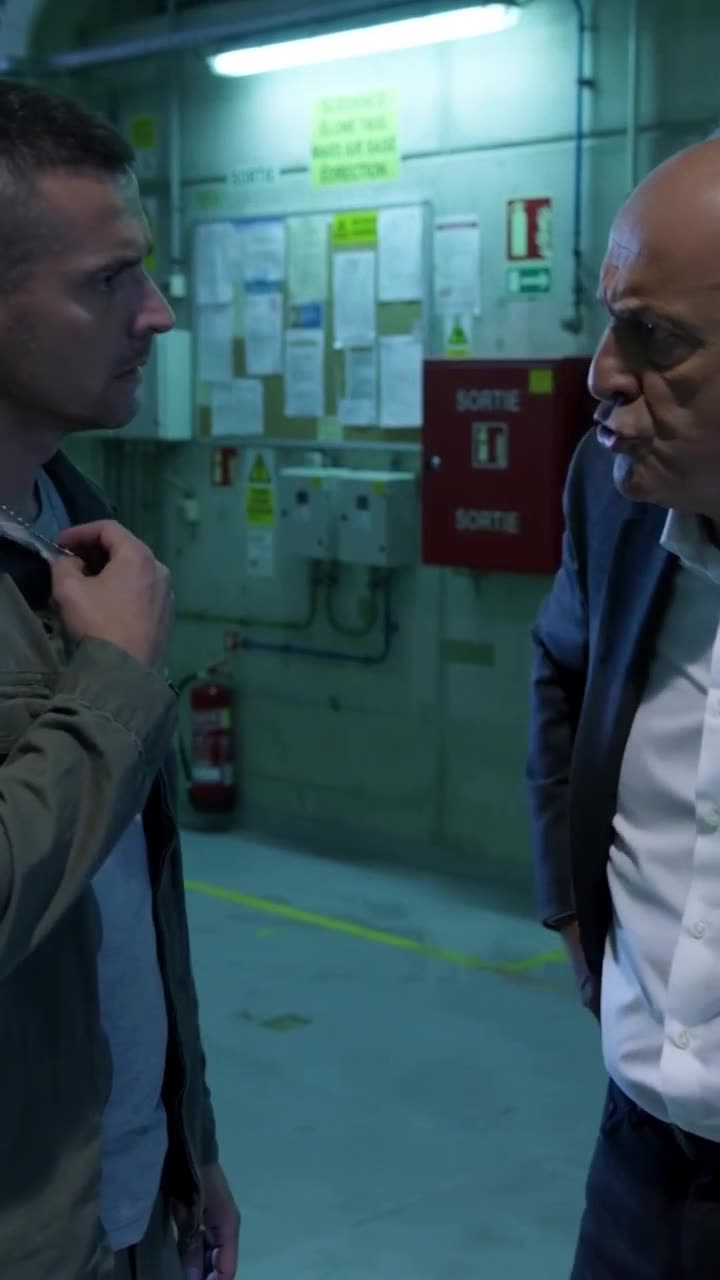 A tense face-to-face confrontation between the commander and the defiant inspector