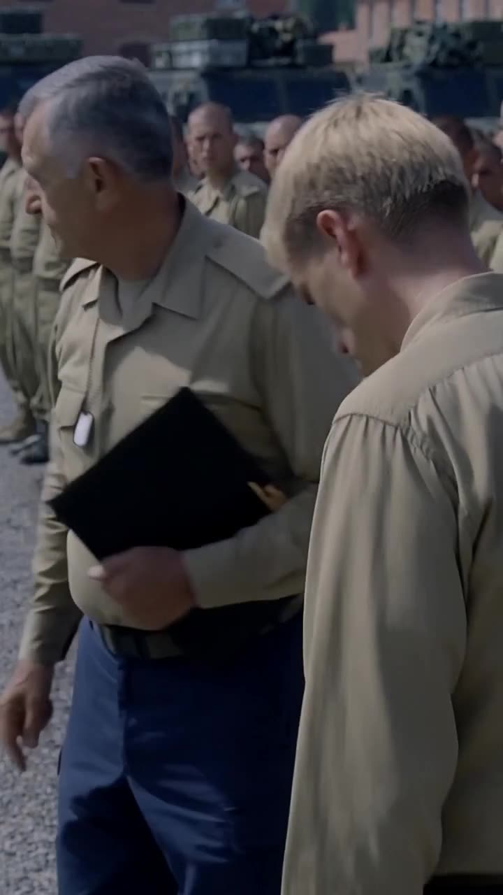 Colonel Roche walks past a crestfallen Julien as the base falls into stunned silence