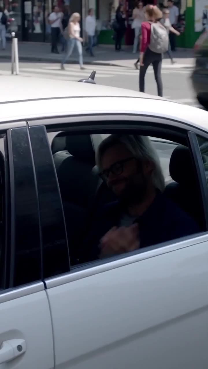 The suspect realizes he is trapped behind sealed car windows after the remote lockdown is activated.