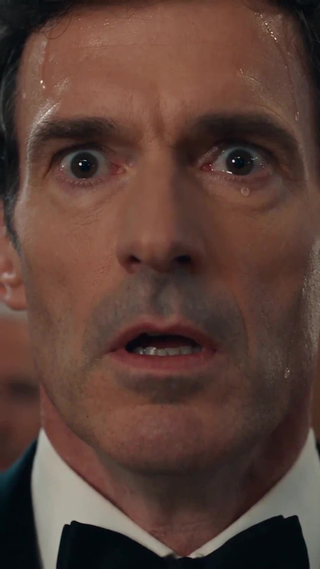 Philippe sweating profusely in his tuxedo with wide, horrified eyes