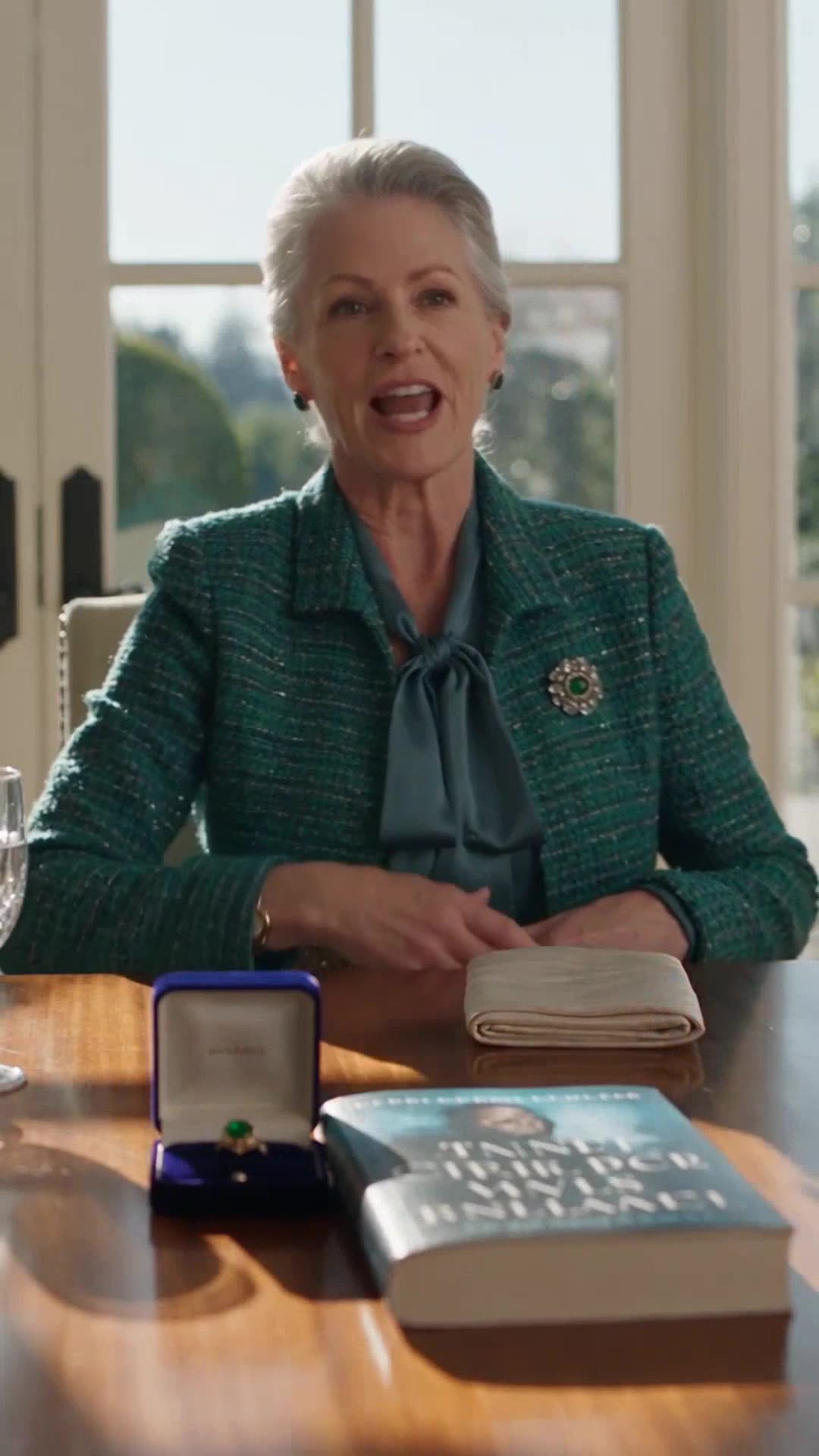 Rosalind Archer presents an heirloom ring box beside her favorite novel.
