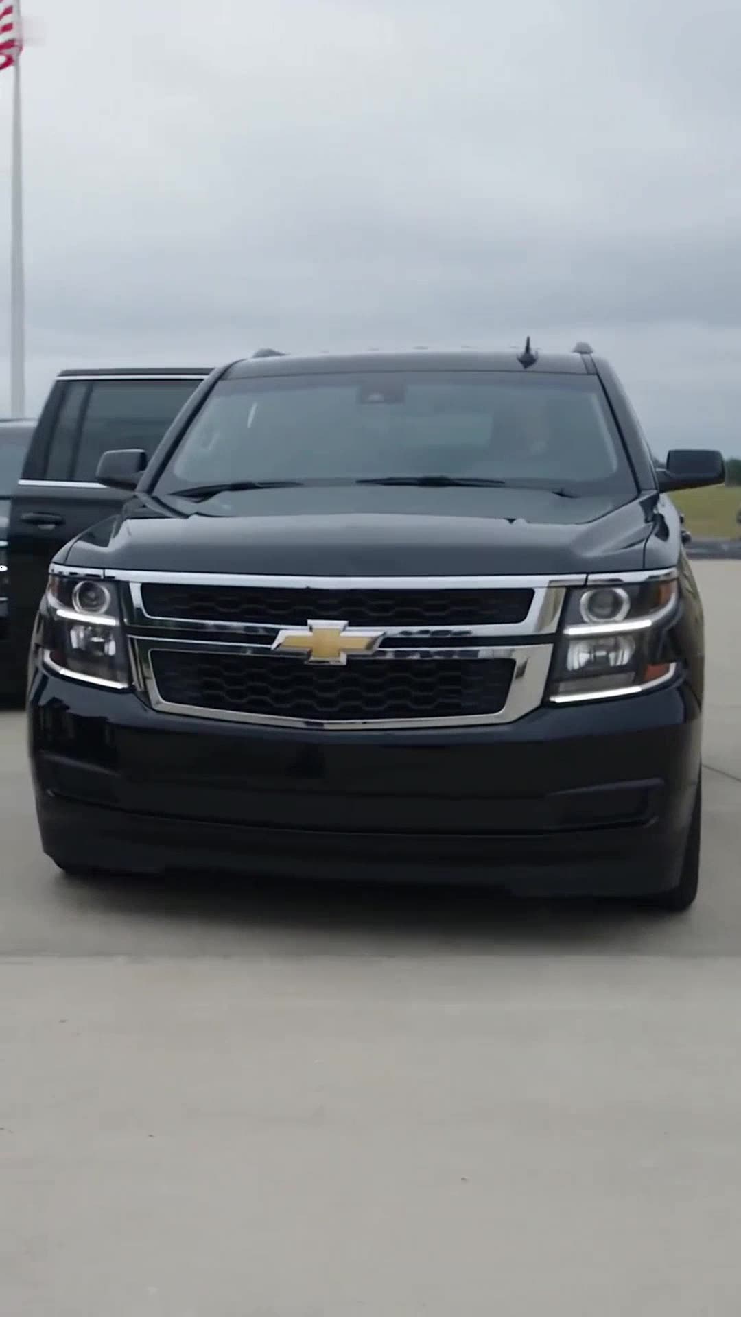A black military SUV arrives in the base courtyard to interrupt the confrontation.
