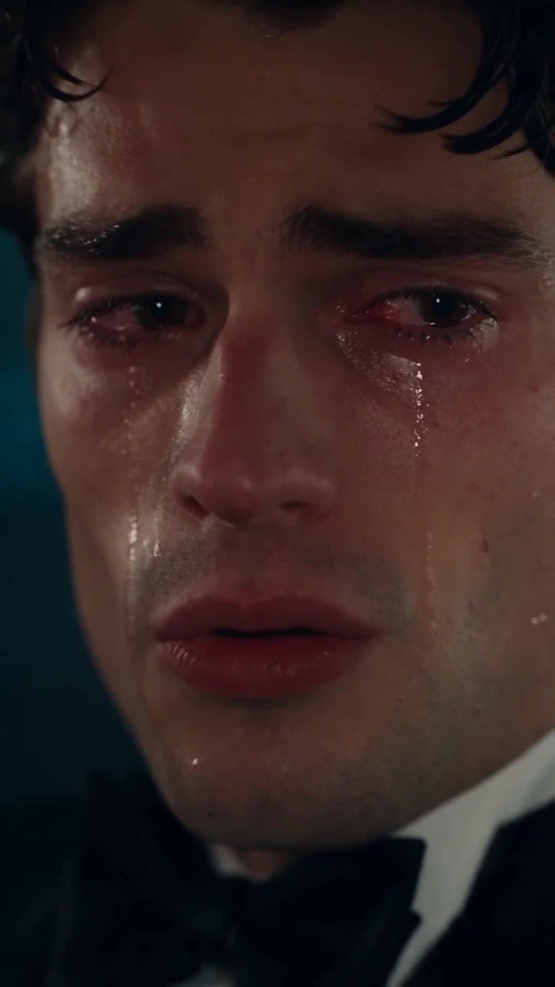Tearful runaway groom looking overwhelmed inside the getaway taxi while admitting the truth
